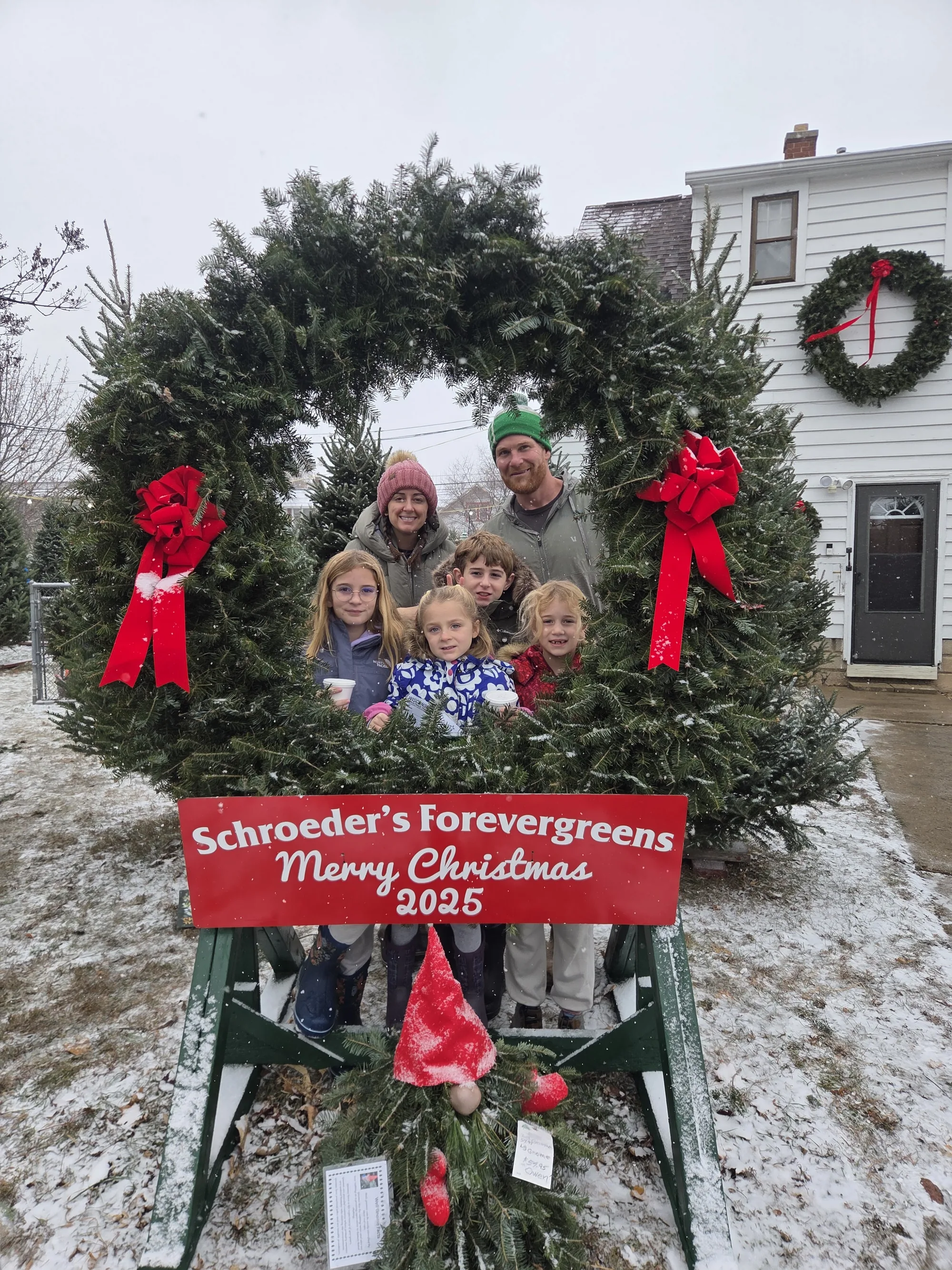 Jason and Kiara Ehrmentraut with their four children, the family behind Earthscape Landscaping in Neenah, Wisconsin.